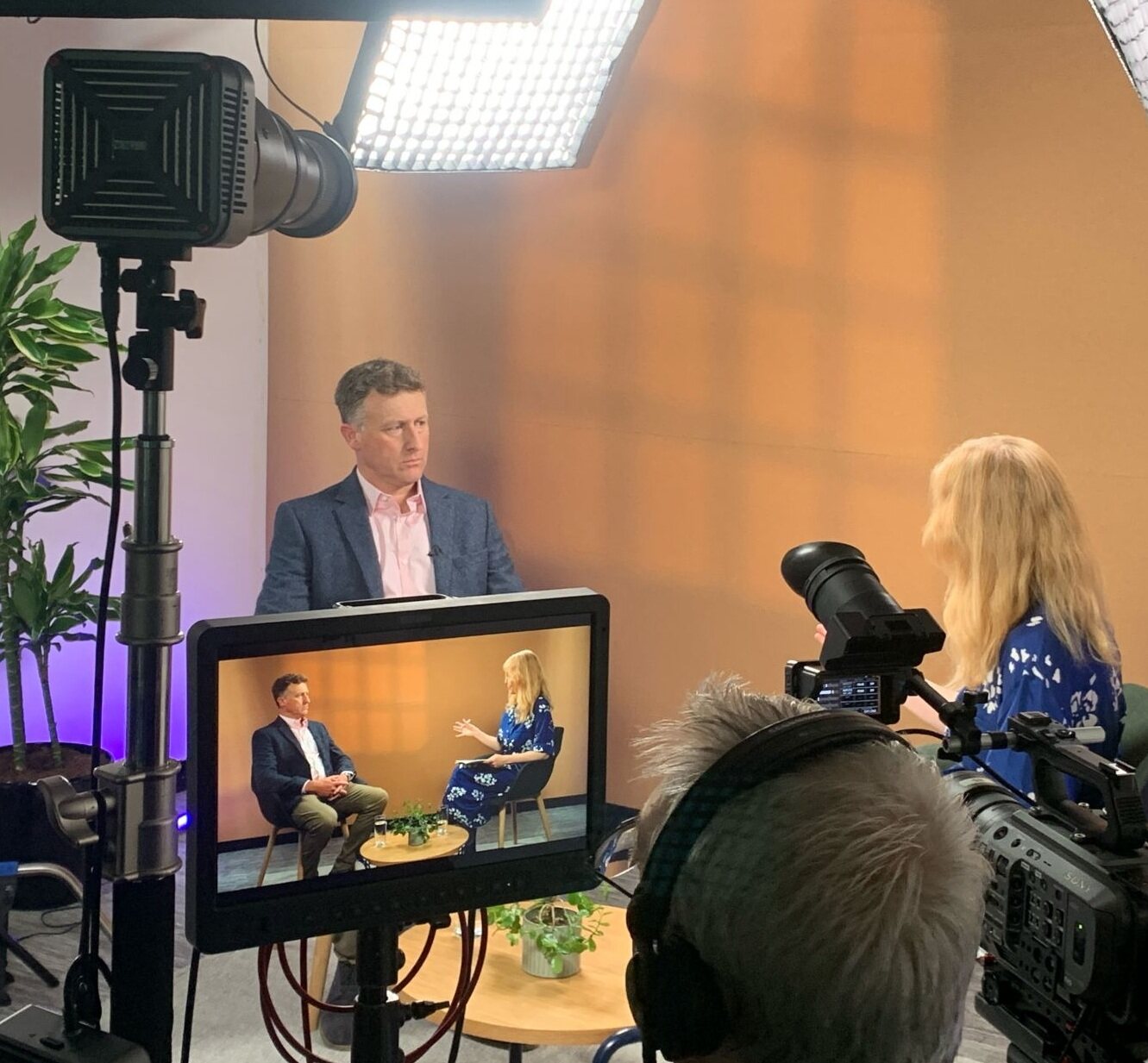 Paul Adams being interviewed in a television studio